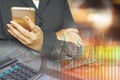 Double exposure of business woman hand holding smart phone , pile of coins, financial graph