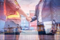 Double Exposure of Businessman and Container Shipping Worker Greeting Handshake Together With Containers Cargo Ship Port Terminal Royalty Free Stock Photo