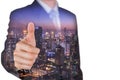 Double exposure of businessman give a thumbs up for compliment and night cityscape as business, praise, congratulate, good and Royalty Free Stock Photo