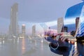 Double exposure businessman hand holding and touch screen smart phone with modern city night background. Royalty Free Stock Photo