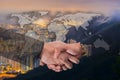 Double Exposure of a businessman handshake on World Global Cartography Globalization with Cityscape Hong Kong Panoramic Night Con Royalty Free Stock Photo