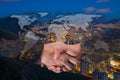 Double Exposure of a businessman handshake on World Global Cartography Globalization with Cityscape Hong Kong Panoramic Night Con Royalty Free Stock Photo