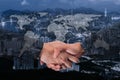 Double Exposure of a businessman handshake on World Global Cartography Globalization ,Hong Kong cityscape in business district bl