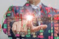 Double exposure of businessman pushing on touch screen with stock market exchange over trading room
