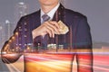 Double exposure of Businessman put Euro money in his suit pocket, light trails on street, urban in the night as business, travel,