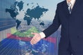 Double exposure of businessman shaking hand with growth graph chart and blurred building and world background, with world map. bus Royalty Free Stock Photo