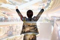 Double exposure of businesswoman in celebrate with shopping mall