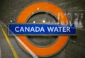 Double exposure in camera of a TFL sign showing ''Canada Water''.