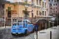 Double exposure of cars moving over city. Abstract urban background. Daytime light.