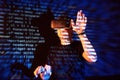 Double exposure of a caucasian man and Virtual reality headset is presumably a gamer or a hacker cracking the code into