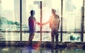 Double exposure, city and business people with handshake, agreement and deal with contract and urban town. Overlay Royalty Free Stock Photo
