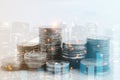 Double exposure of city view , diagram bar and line graph , rows of coins for finance , money , investment and business concept