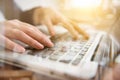 Double exposure of Close up business woman hand working on laptop computer on wooden desk as concept.