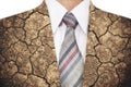 Double exposure, close-up businessman with cracked arid soil ground texture