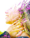 Double exposure close up profile portrait of a young pretty woman interwoven with bright purple Bougainvillea flowers seemingly Royalty Free Stock Photo