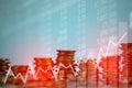 Double exposure of coin stack with stock market screen chart boa Royalty Free Stock Photo