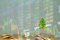 Double exposure of coin stack with stock market screen chart boa Royalty Free Stock Photo