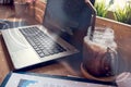 Double exposure of computer on the table inside coffee shop. Royalty Free Stock Photo