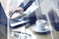 Double exposure concept.Businessman working at sunny office on laptop while sitting at the wooden table.Man holding Royalty Free Stock Photo