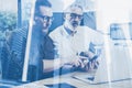 Double exposure concept.Team of business people making great work discussion in studio.Young bearded man showing mobile Royalty Free Stock Photo