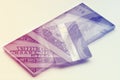 Double exposure: Credit card on hundres dollar bills closeup. Vintage style Royalty Free Stock Photo