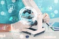 Double exposure of doctor working with microscope, machine learning model Royalty Free Stock Photo