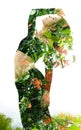 Double exposure of an elegant girl leaning back combined with photograph of bright tropical plants with vibrant flowers
