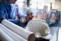 Double exposure of Engineer with oil refinery industry plant background, industrial instruments in the factory and physical system