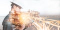 Double exposure of Engineer or Technician man with safety helmet operated platform or plant by using tablet with offshore oil and Royalty Free Stock Photo