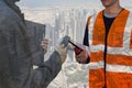 Double exposure engineering hand holding portable radio and process flow diagram for construction,asian engineer monitoring site