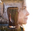 Double exposure of female traveller combined with peaceful temple setting in southeast asia