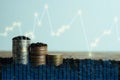 Double exposure of graph and rows of coins for finance and business concept Royalty Free Stock Photo