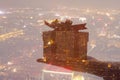 Double exposure of hand holding gift over night cityscape Royalty Free Stock Photo