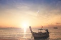 Sunrise sky background concept: Traditional Thai long tail boat at beautiful sunrise background Royalty Free Stock Photo