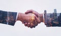 Double exposure of a handshake over a cityscape Royalty Free Stock Photo