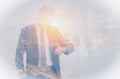 Double Exposure image of Businessman looking at the time on his