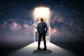 The double exposure image of the businessman standing front of the door is opening during sunrise overlay with cityscape and astro Royalty Free Stock Photo