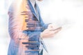 Double exposure image of businessman using digital tablet on city blurred background. Business success concept Royalty Free Stock Photo