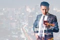 The double exposure image of the businessman using a smartphone and overlay with cityscape image. the concept of 5G, smartphones,