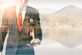 The double exposure image of the businessman using a smartphone during sunrise overlay with nature image. The concept of telecommu Royalty Free Stock Photo