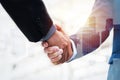 Double exposure image of investor business man handshake with partner