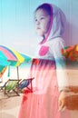 Double exposure of little girl dreaming about beach