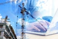 Double exposure of male programmer using laptop and construction site