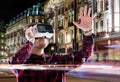 Double exposure, man wearing virtual reality goggles, night city Royalty Free Stock Photo