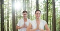 Double exposure of man and woman with hands clasped in forest Royalty Free Stock Photo