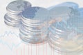 Double exposure of money coin stack with growing graph. Royalty Free Stock Photo