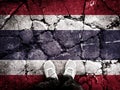 Double exposure of the national flag of Thailand with cracks in the gravel