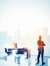 Double exposure photo of businessman in contemporary office. Vertical, color
