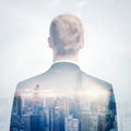 Double exposure portrait of a businessman looking