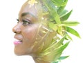 A double exposure portrait of a female model combined with an image of green leaves. Royalty Free Stock Photo
